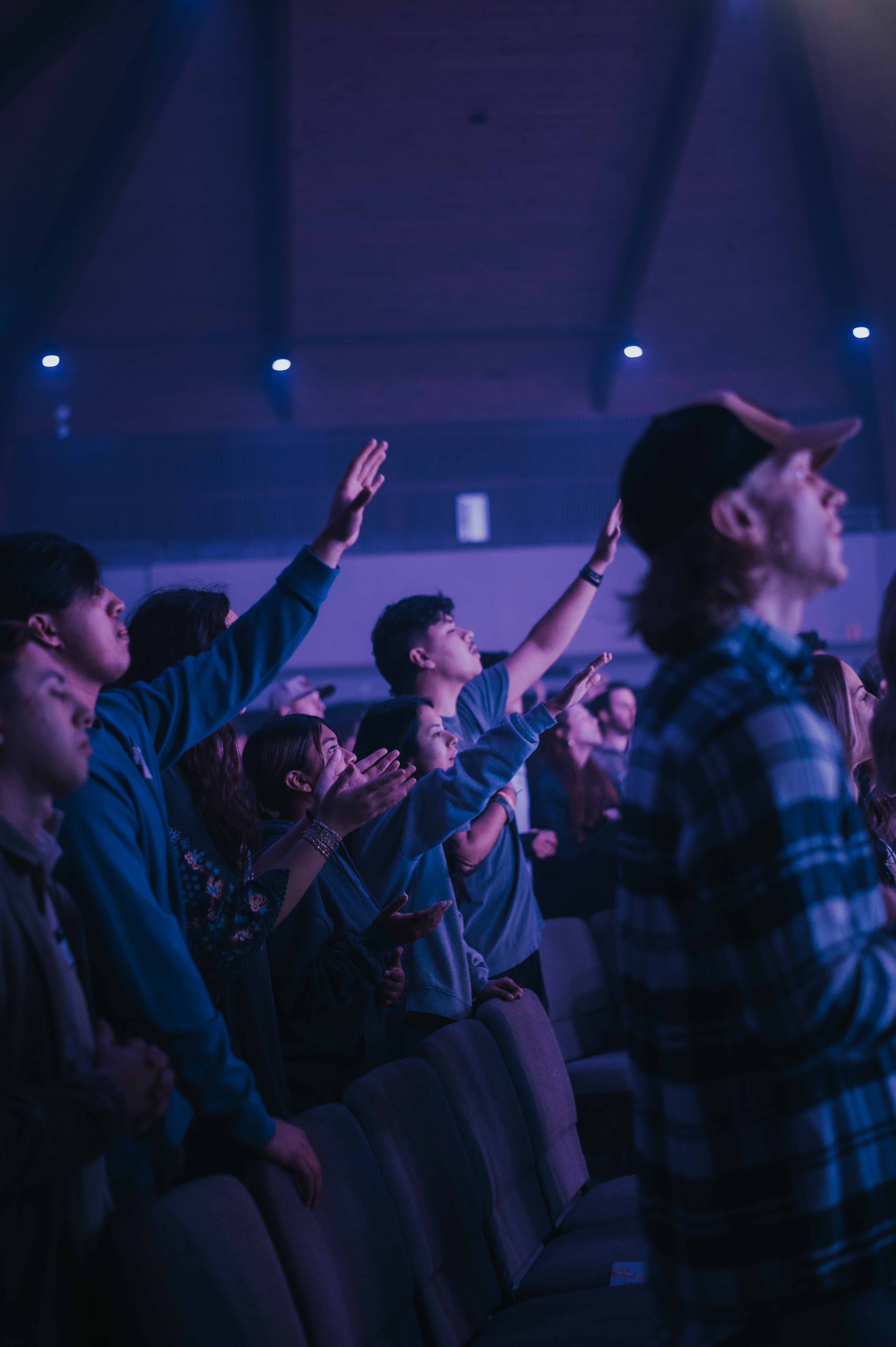 Young adults worshipping